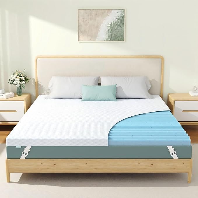 Topper Sognalia su un letto matrimoniale